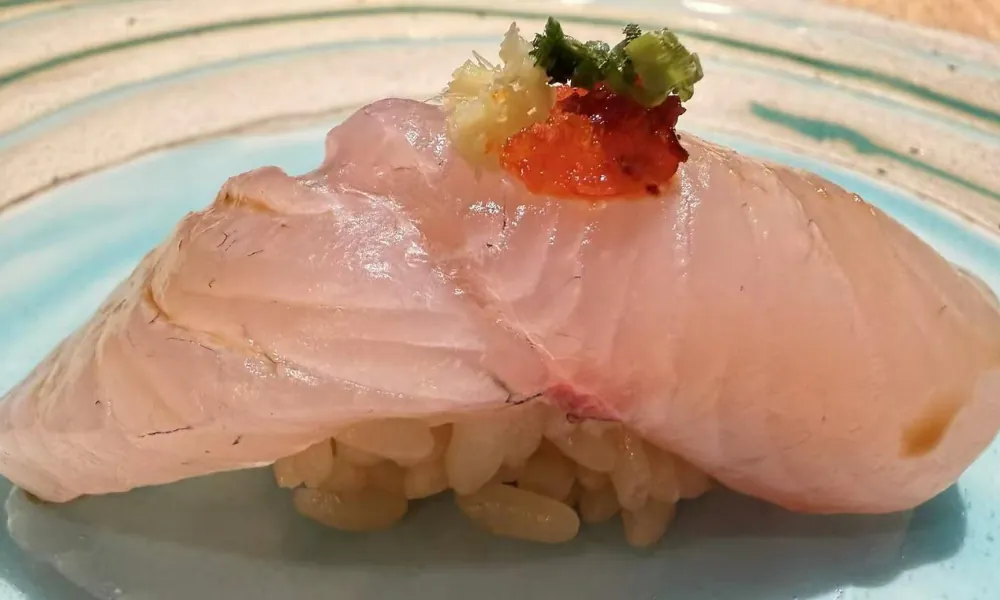 Fresh Madai nigiri with yuzu kosho and ginger at Ki Omakase, a Sushi Restaurant in Little Neck